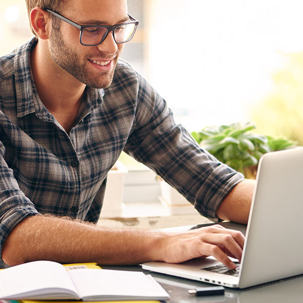 woman writing goals for website